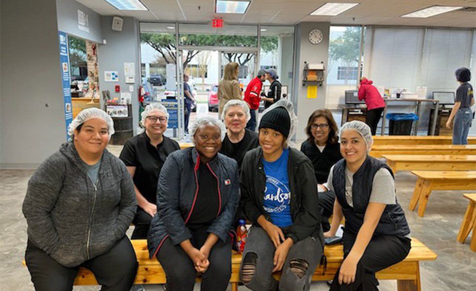 Team members volunteering at a food pantry