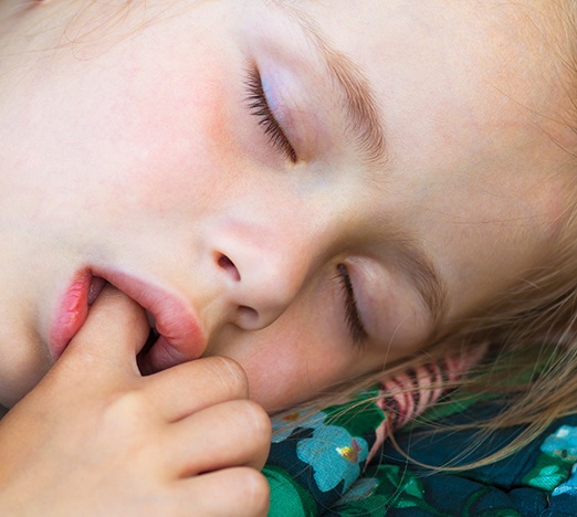 Child sucking their thumb