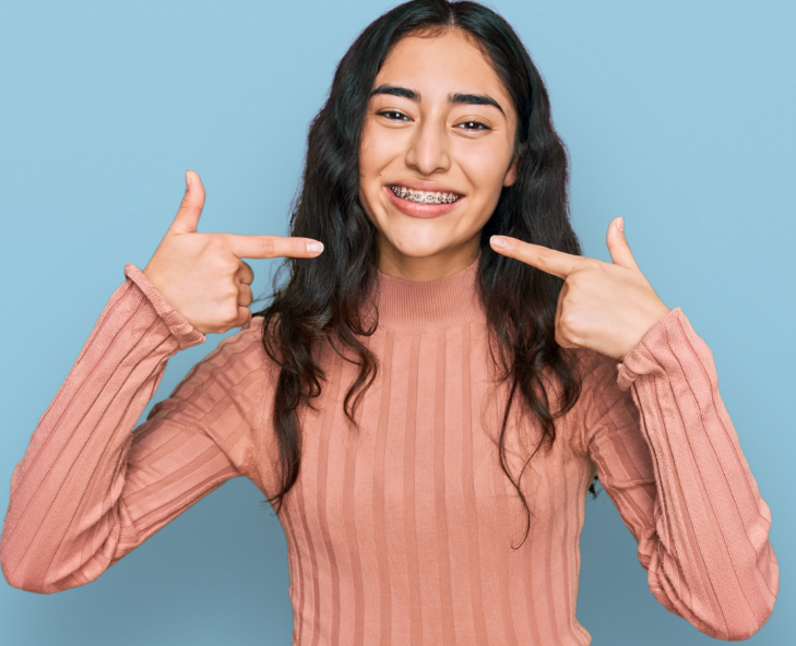 Girl pointing at braces
