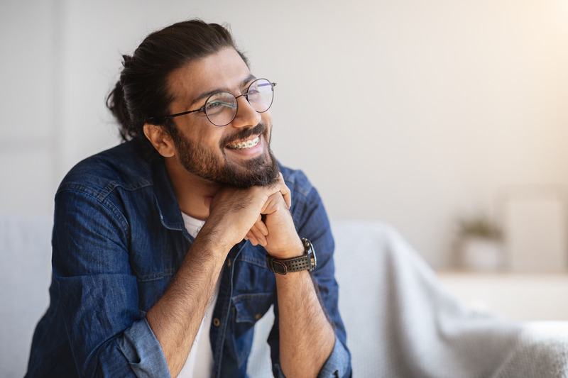 Patient smiling with traditional braces